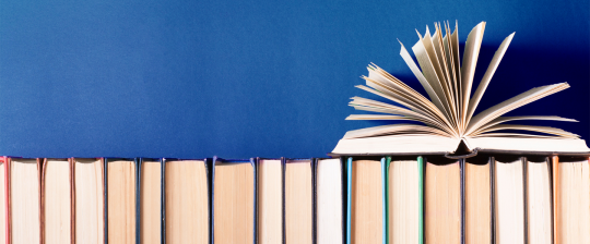 Open Book on stack of books